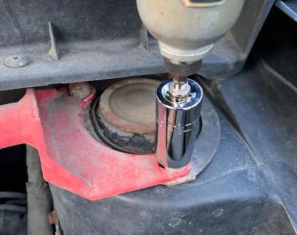 Power drill with socket attachment tightening bolt on car strut mount